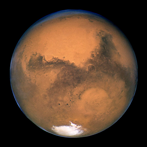 El Telescopio Espacial Hubble obtuvo esta imagen de Marte un día después de su oposición del 27 de agosto de 2003, durante la que se produjo la máxima aproximación entre el planeta rojo y la Tierra de los últimos 60.000 años. Créditos: STScI/NASA/ESA.
